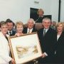 Taoiseach Bertie Ahern presented with a hamilton sloan watercolour of the gweedore court hotel the lake and mount errigal by the Doherty family
