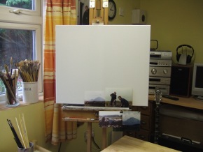 photo of studio showing canvas subject matter brushes and banjo