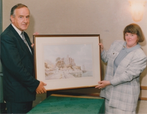 Taoiseach Albert Reynolds presented with a Hamilton Sloan painting by Carlingford Heritage Centre