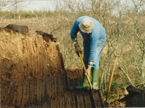 Donegal man cutting a turf bank on his own