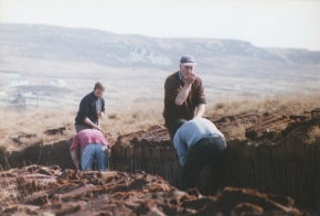 Irish Turfcutters working in pairs